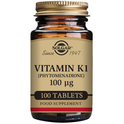 Solgar 100 capsules Vitamin K1 and its brown supplement jar on the white background